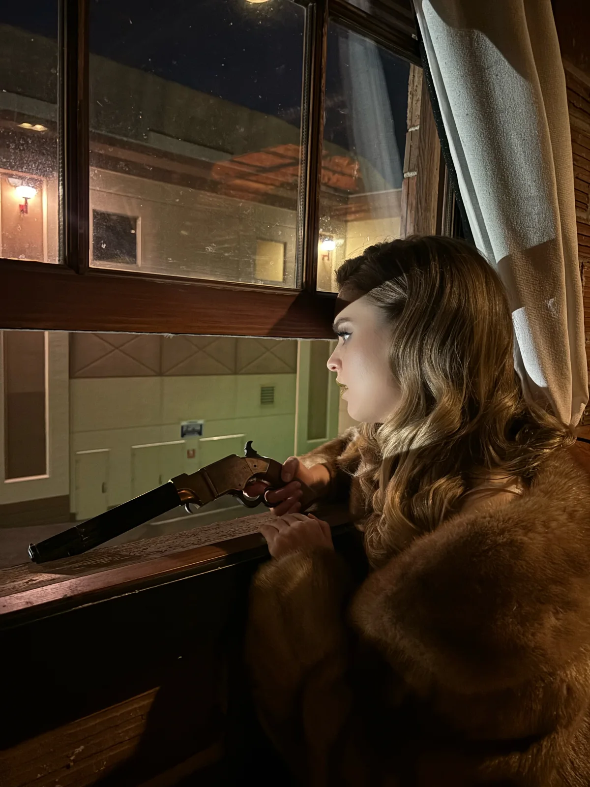 Hannah Krostewitz framed by a window during Last of a Dying Breed production